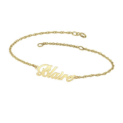 personalized name bracelet with cursive font in 10k yellow gold