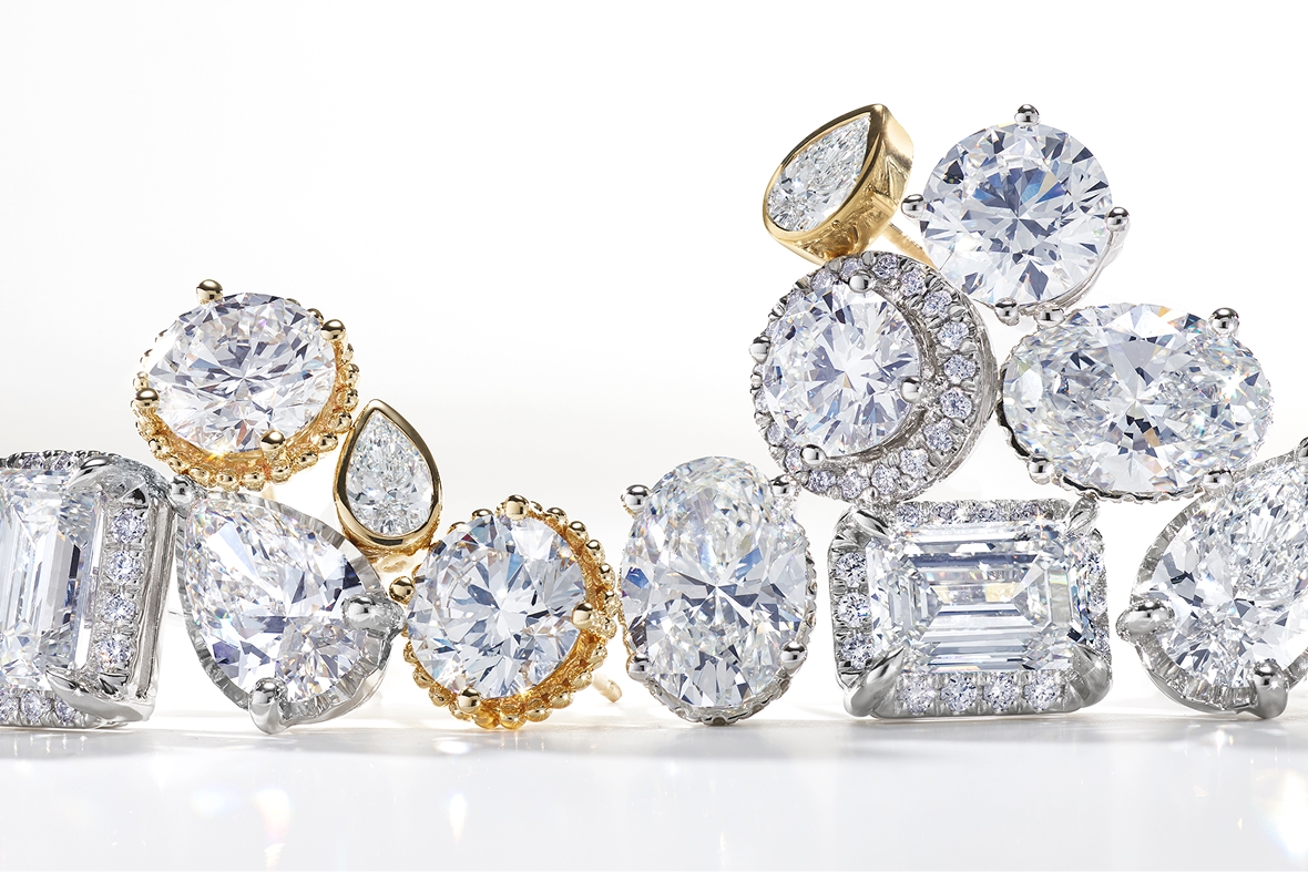 a stack of different styles of diamond solitaire studs