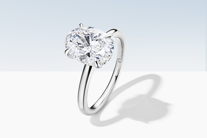 A yellow gold pear solitaire engagement ring