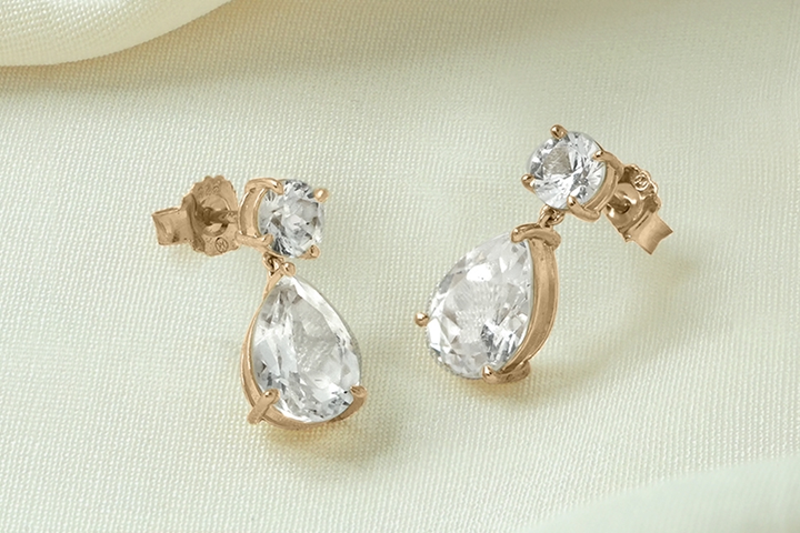 An image of yellow gold and diamond drop earrings