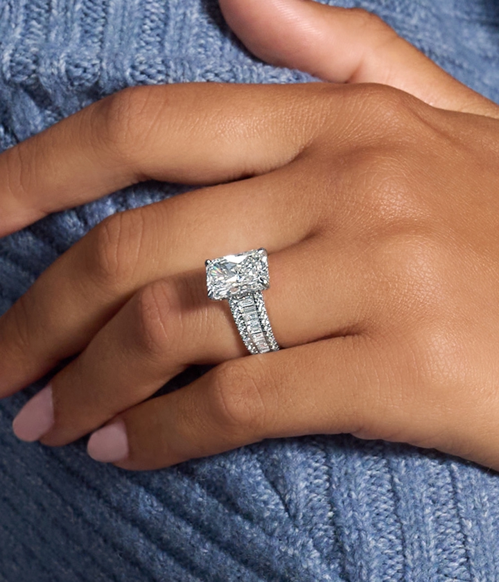 Close up of hand wearing a custom made engagement ring,