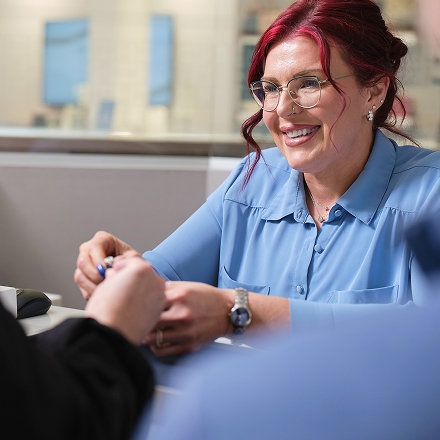 A Helzberg jewelry expert meeting with a customer for an in-store appointment.