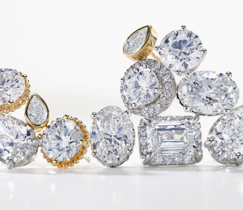 Custom diamond stud earrings in a grouping on a white background