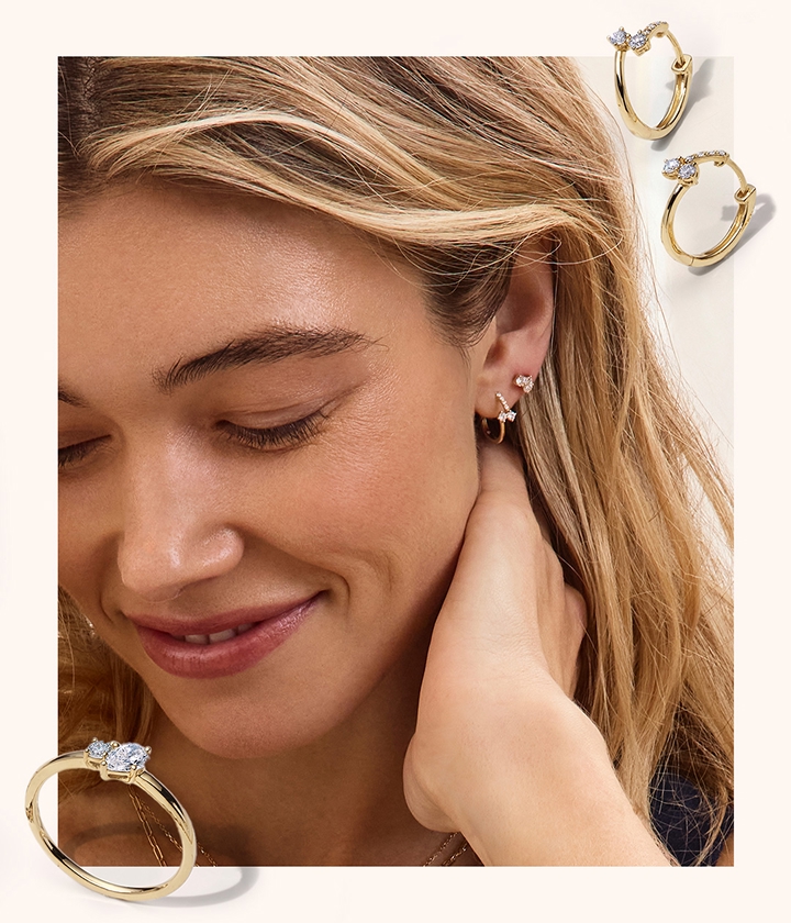 A woman looking down with her Scout & Lark Earring stack showing