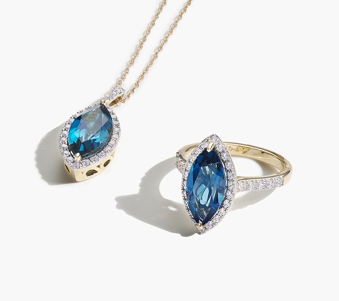 A marquise shaped London blue topaz necklace and ring,