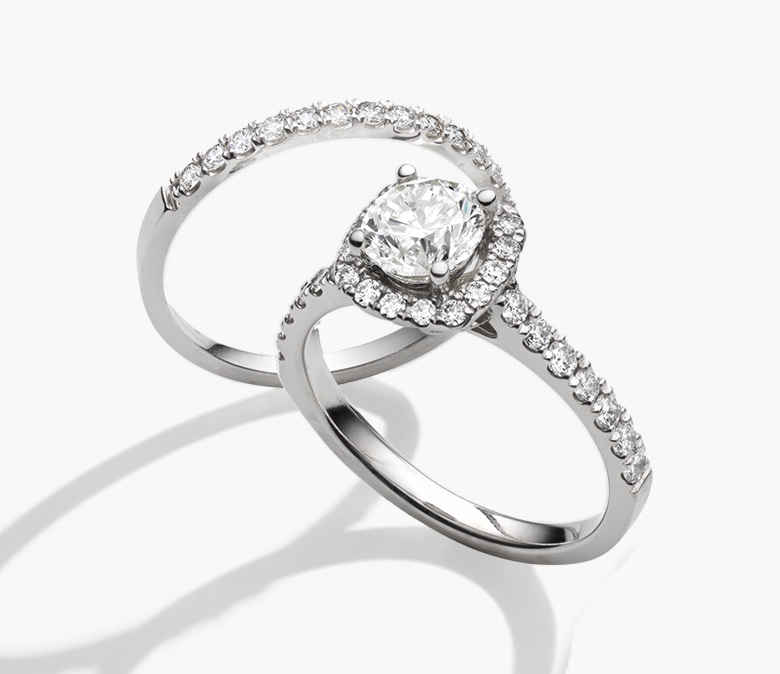 White gold halo diamond ring with matching diamond band.