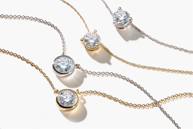 four round diamond solitaire pendant necklaces