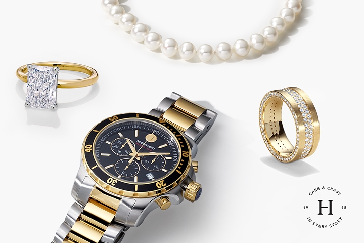 An image of a gold watch, engagement ring, wedding band, and pearl necklace