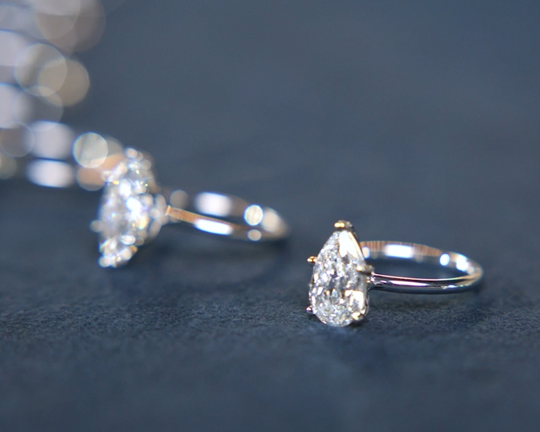 A video of an assortment of engagement rings of all diamond shapes on display.